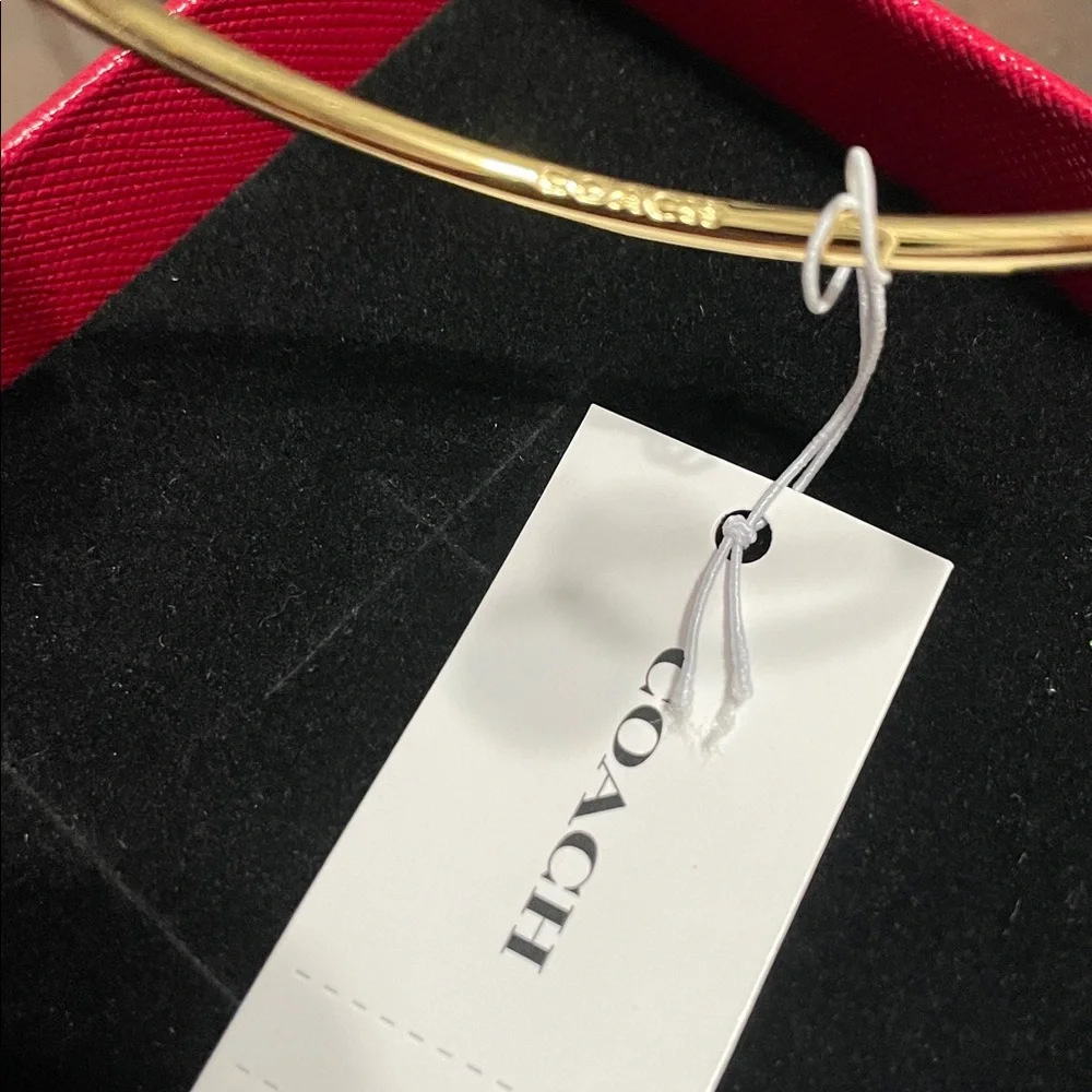 Coach Gold-Tone Open Cuff Bracelet with Crystal Ends